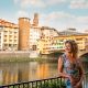 Woman standing near Ponte Vecchio bridge Florenec