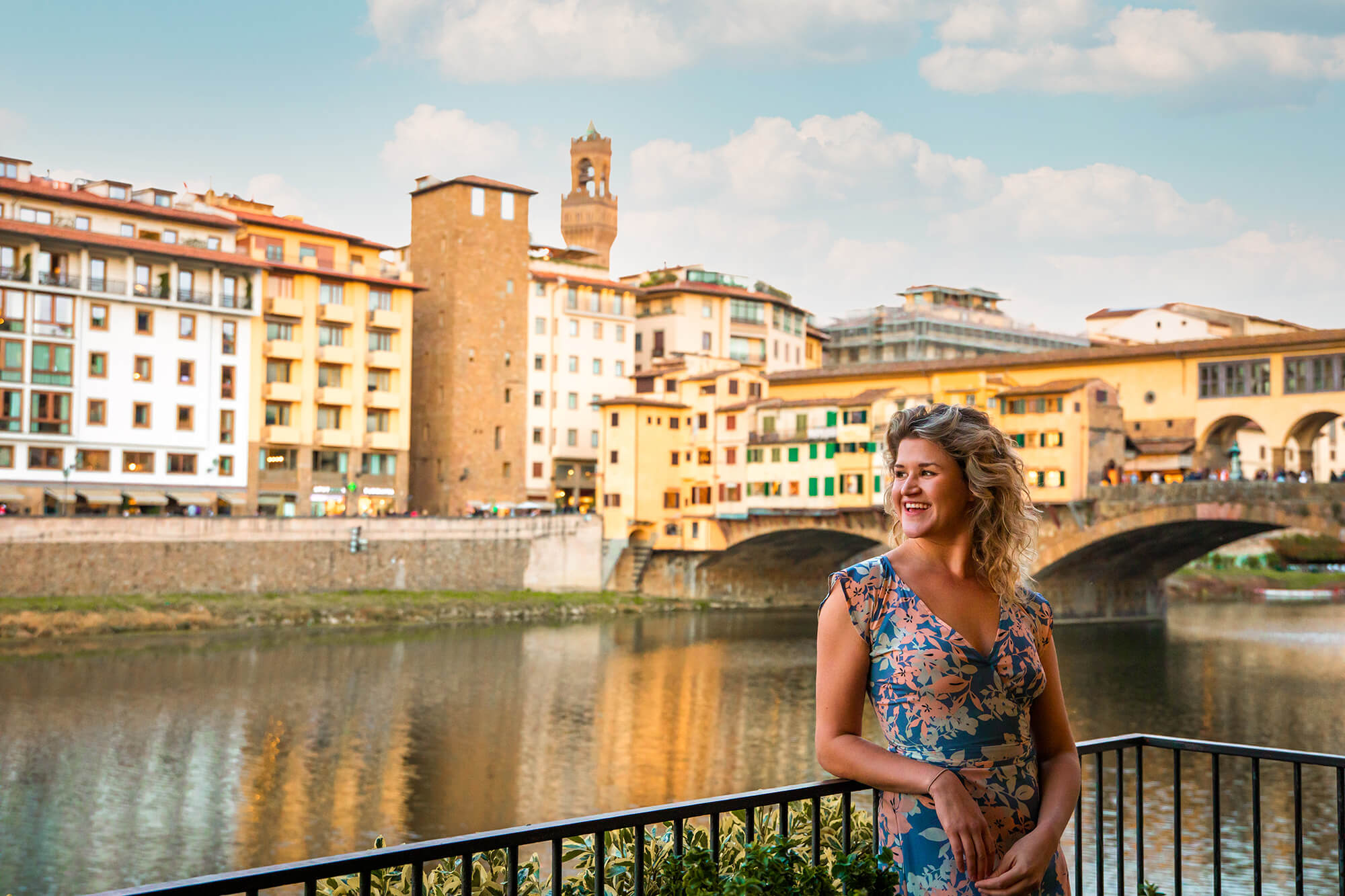 Woman standing near Ponte Vecchio bridge Florenec